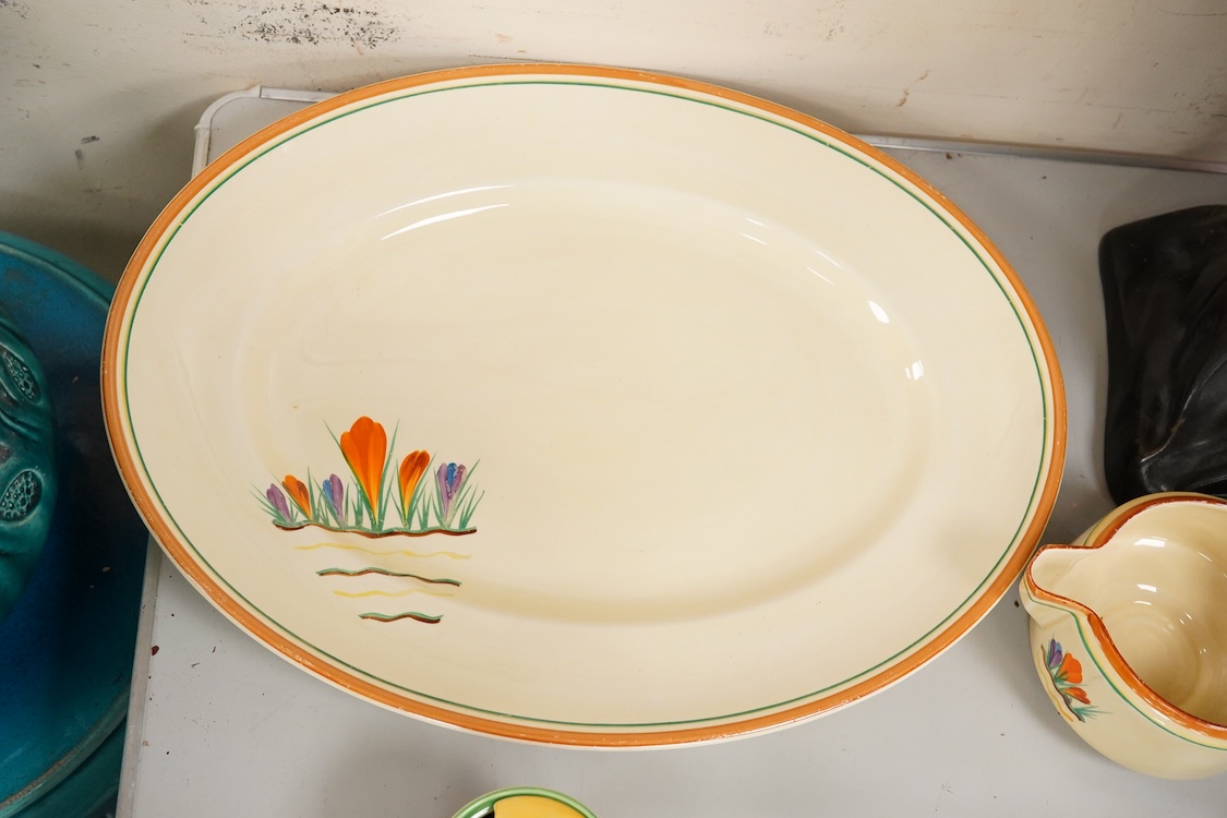 A Clarice Cliff ‘crocus pattern’ tureen and cover, jug, honey pot with cover and an oval meat platter - 43cm wide